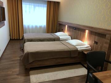 Фото номера Двухместный номер с 2 отдельными кроватями Отель Hotell Wesenbergh г. Раквере 8